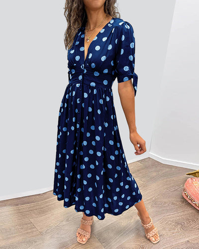 ANKA | Polka dot dress with flared hem and accentuated waist