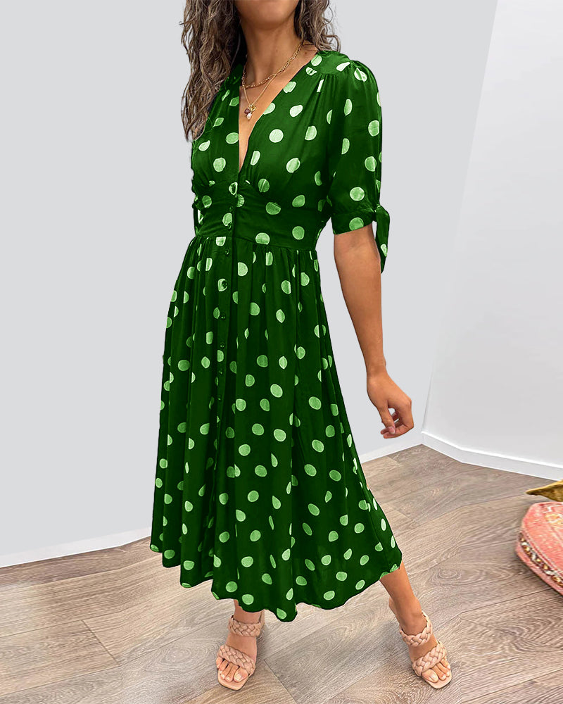 ANKA | Polka dot dress with flared hem and accentuated waist