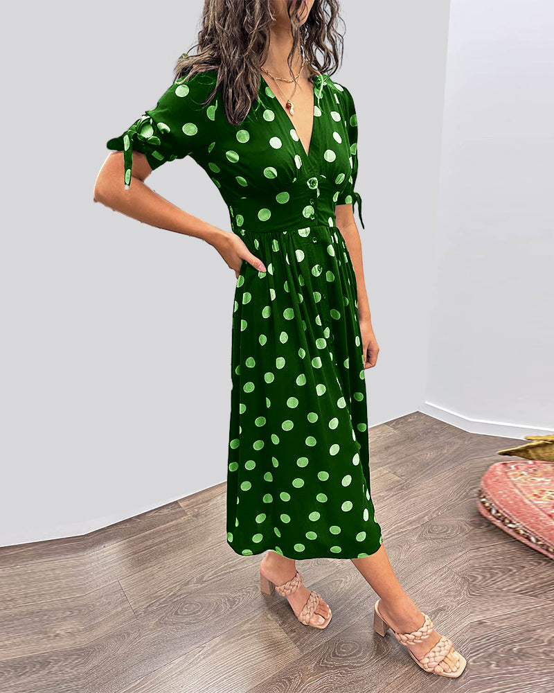 ANKA | Polka dot dress with flared hem and accentuated waist