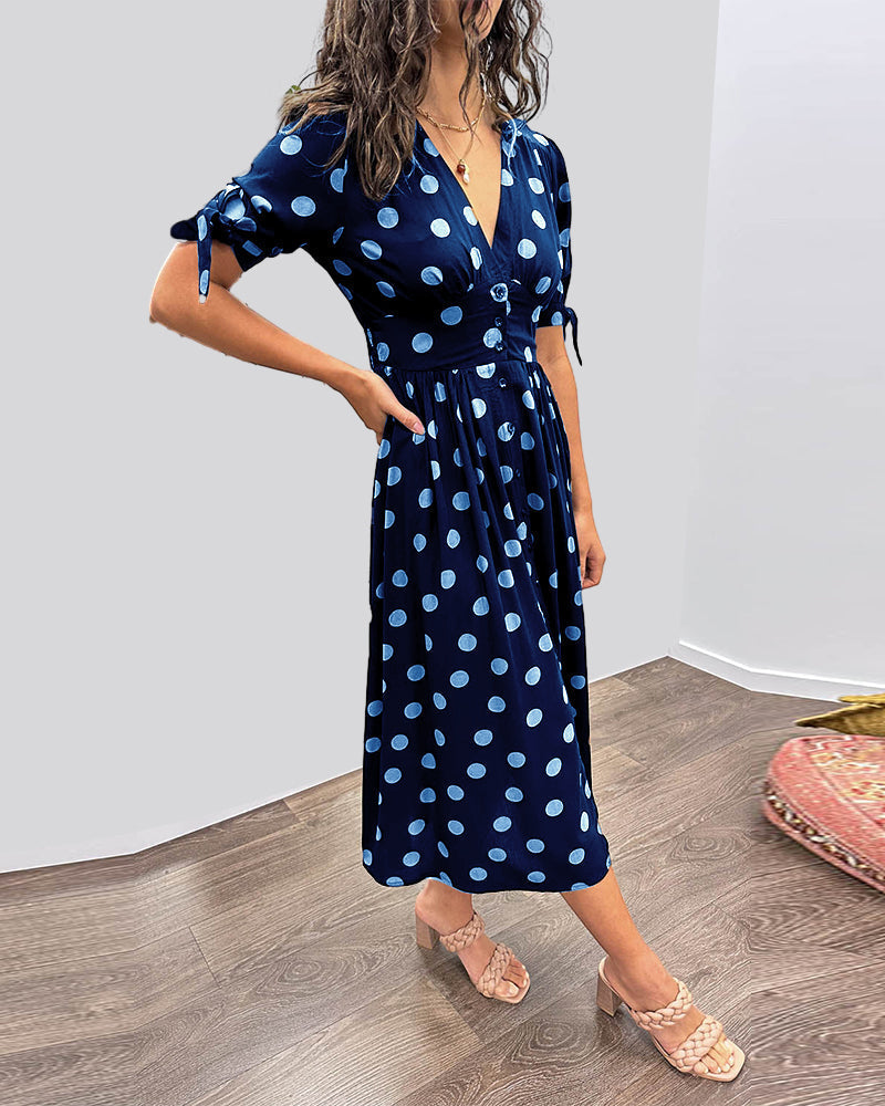 ANKA | Polka dot dress with flared hem and accentuated waist