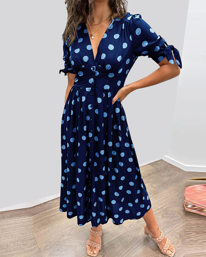ANKA | Polka dot dress with flared hem and accentuated waist