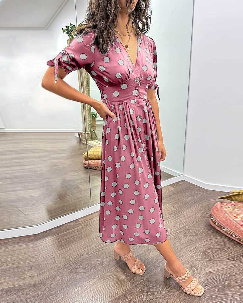 ANKA | Polka dot dress with flared hem and accentuated waist